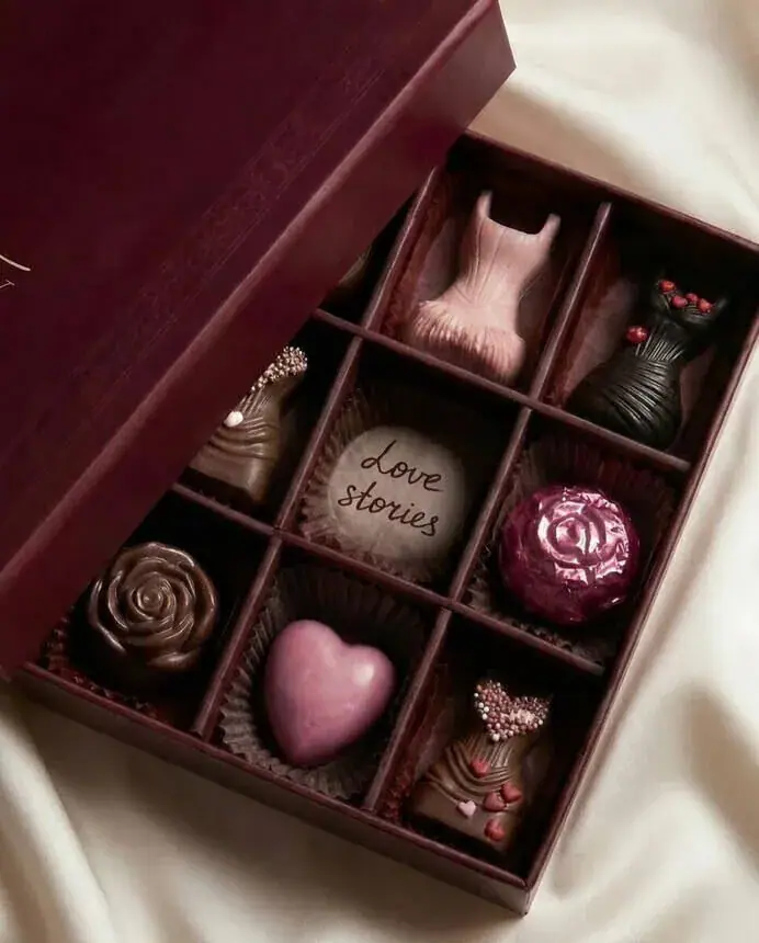 Product campaign frame for gifting brands: open praline box on silk