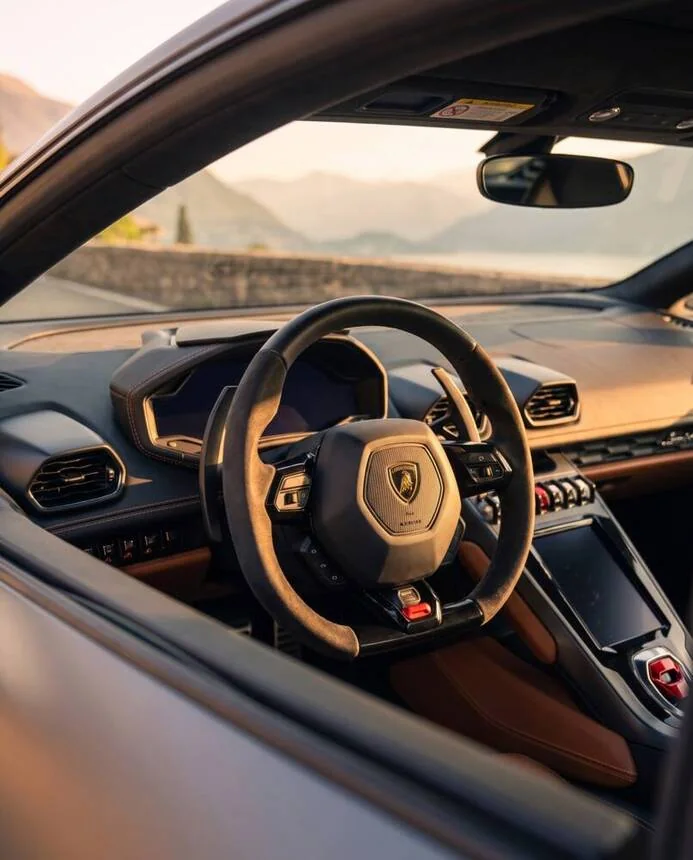 Driver's seat and steering wheel at sunset