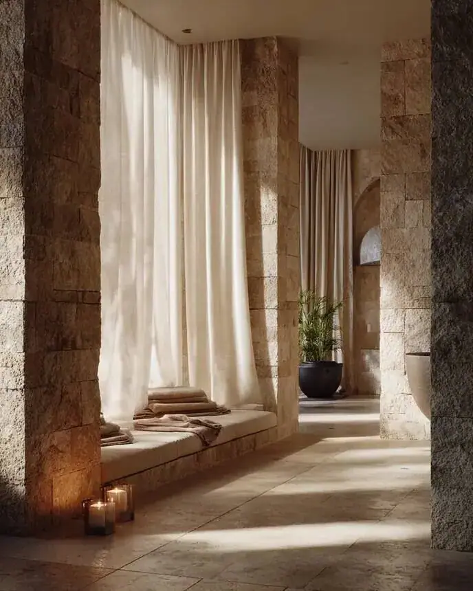 Spa and wellness campaign image: stone spa corridor with warm light, for hotels and spas